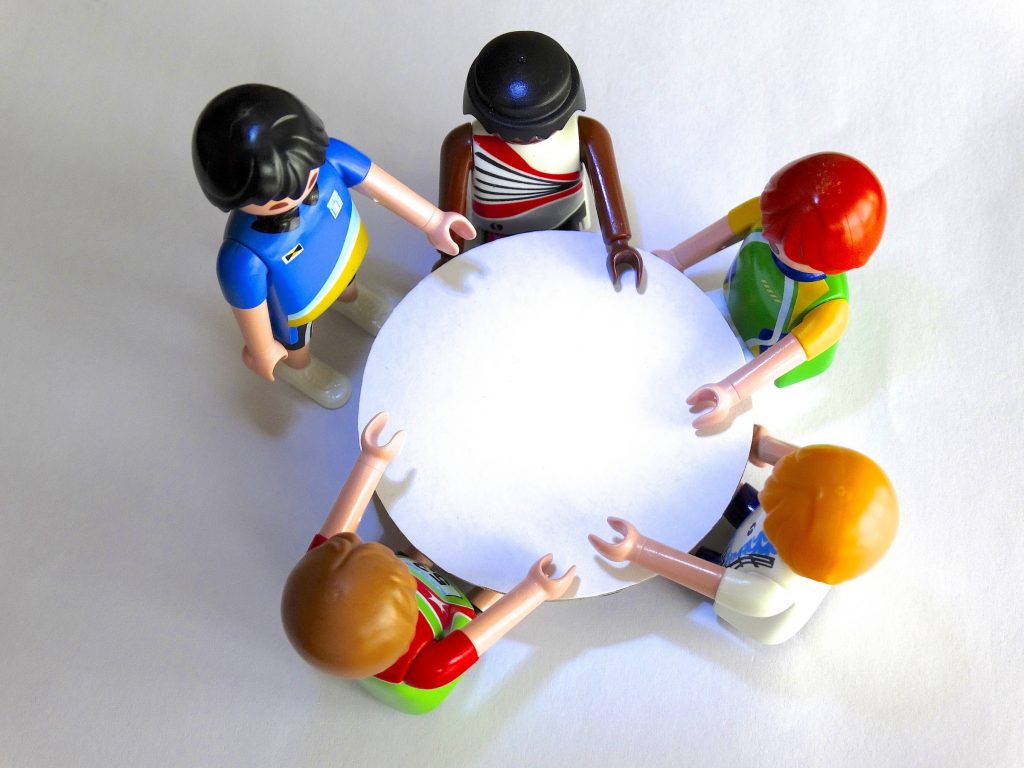 A round table meeting of Playmobil characters