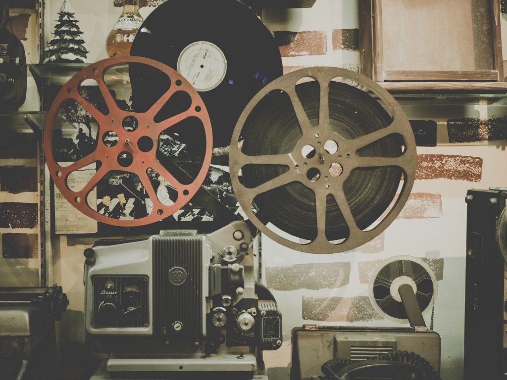 An oldschool movie projector in a projection booth